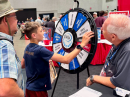 Attendees who shared how their radio clubs are helping grow amateur radio were invited to spin the wheel at the ARRL Year of the Club booth.